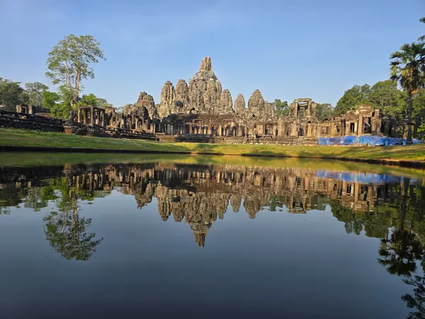 Bayon temple mirrored in the morning stillness